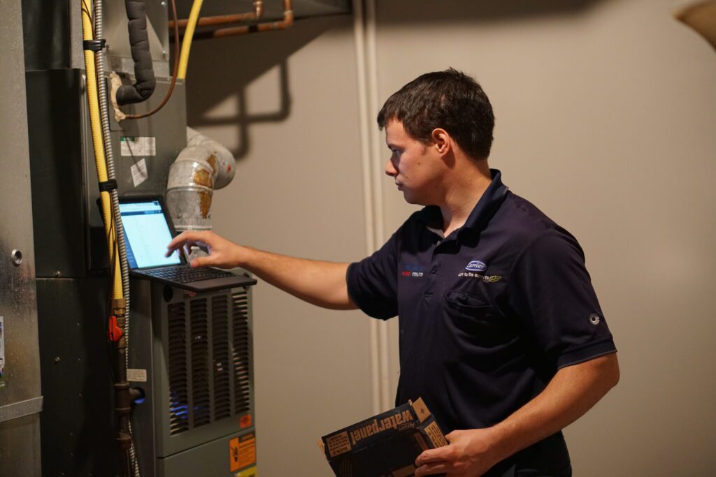 Chillicothe Heating & Cooling HVAC technician located in the Chillicothe, Ohio performing a fall furnace tune-up.